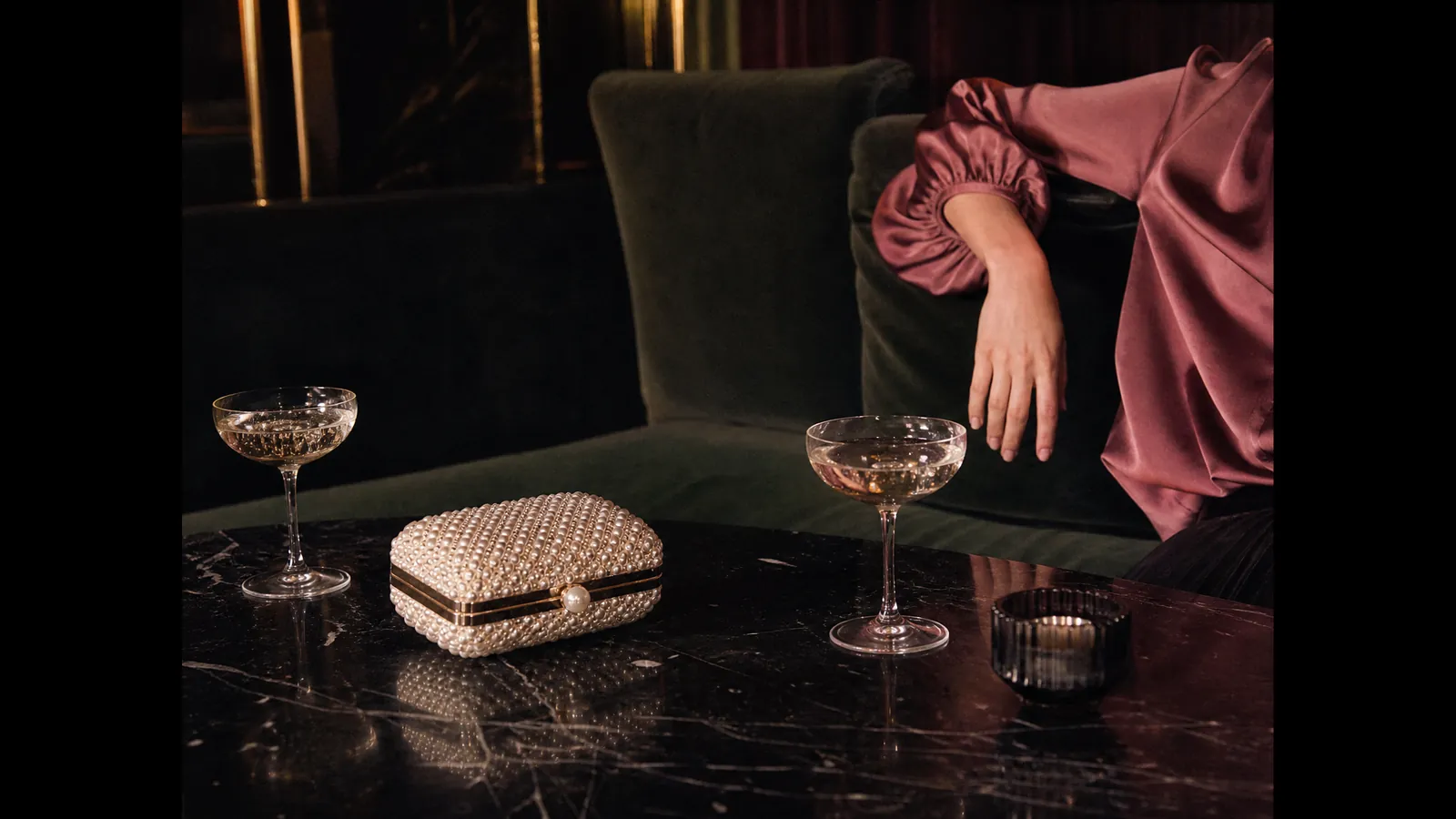 Dusty rose puff-sleeve blouse and a beaded box clutch